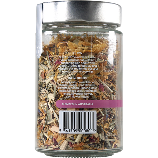 Glass jar filled with dried herbs on a white background