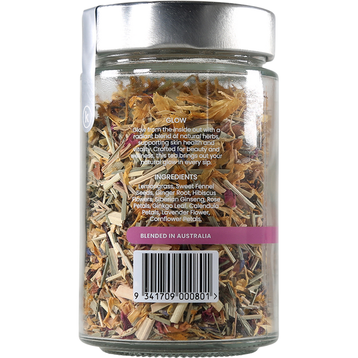 Glass jar filled with dried herbs on a white background