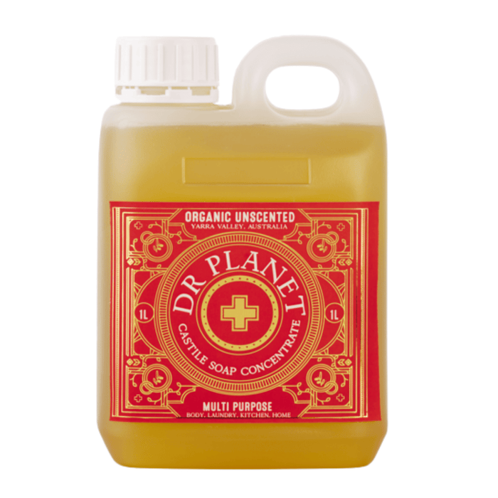 Dr. Planet organic unscented castile soap concentrate bottle with yellow liquid and a red label in a clear plastic jug